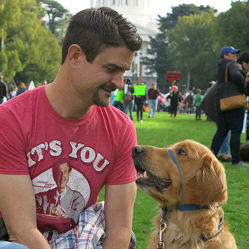 Josh Nash looking at Dog nammed Oggie